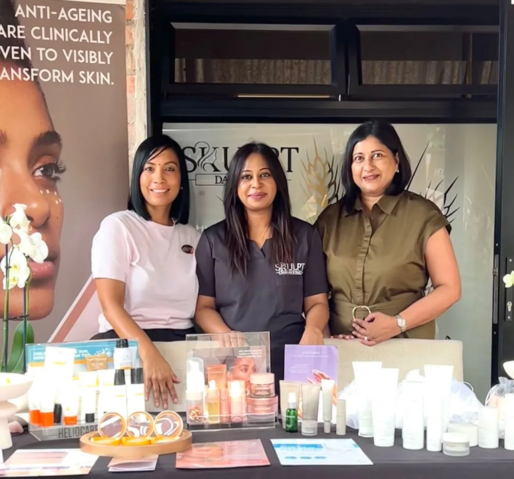 The Skulpt Aesthetics & Beauty team at their product counter