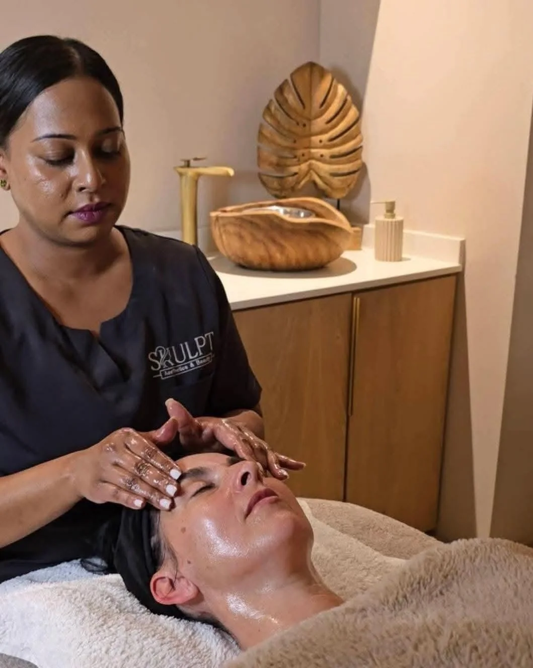 Skulpt therapist performing a Dermalogica facial treatment